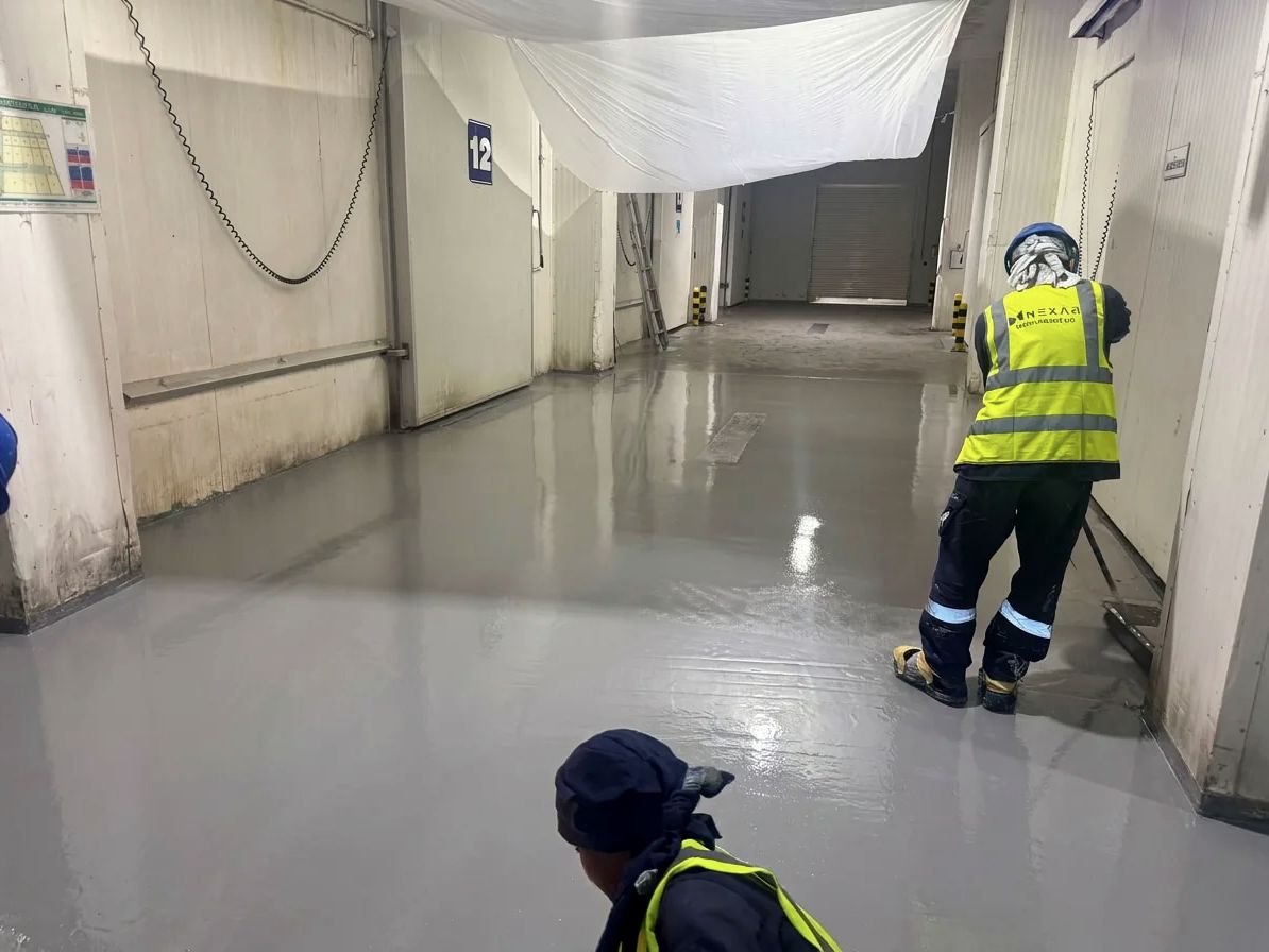 Nexar applicators preparing a corridor floor